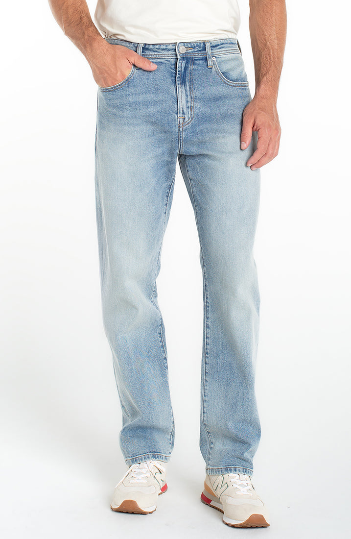 Men’s loose straight light wash stretch denim jeans front view
