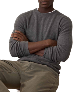 Man wearing Sweater Tee in Charcoal with arms crossed, showing sleeve and knit texture detail - The Simple Man