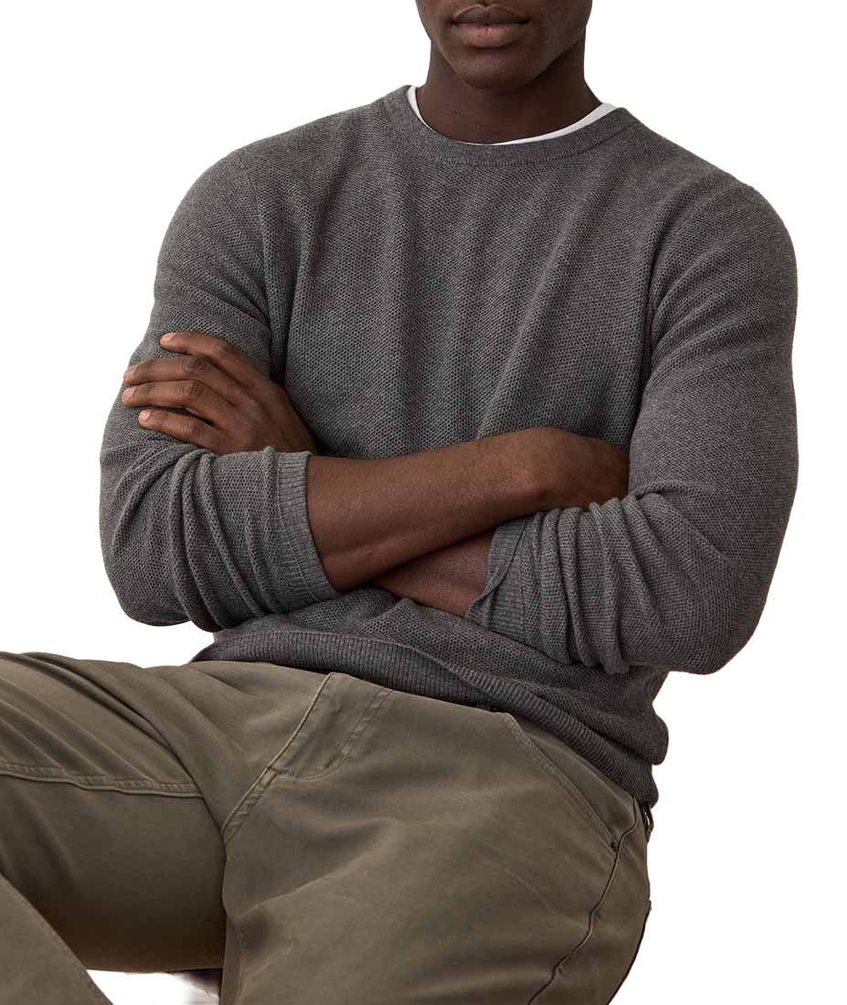 Man wearing Sweater Tee in Charcoal with arms crossed, showing sleeve and knit texture detail - The Simple Man
