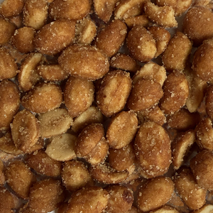 Close-up of roasted peanuts with a sugary, smoky seasoning coating, detail view