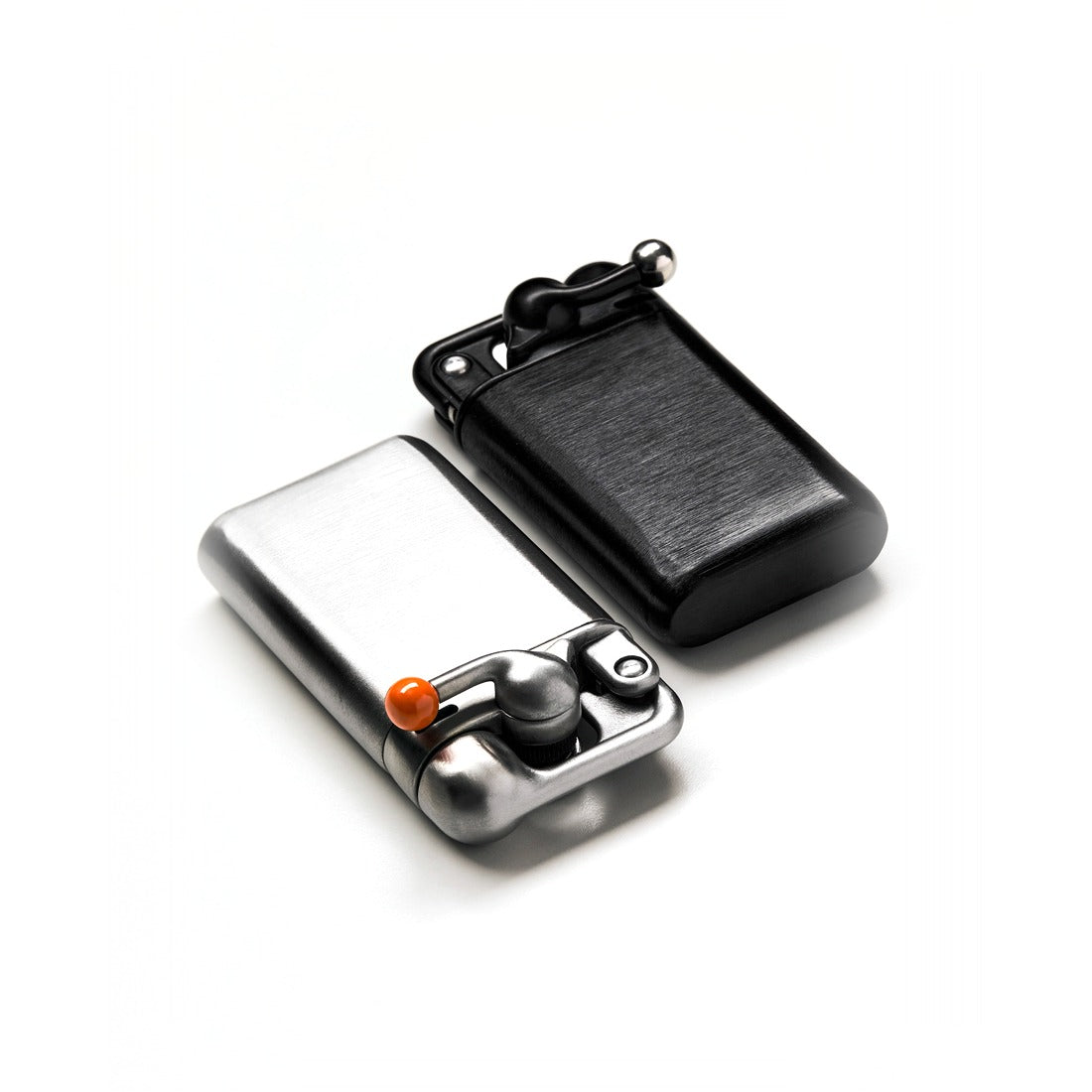 Stainless steel and black Swingtop Lighters side by side - The Simple Man