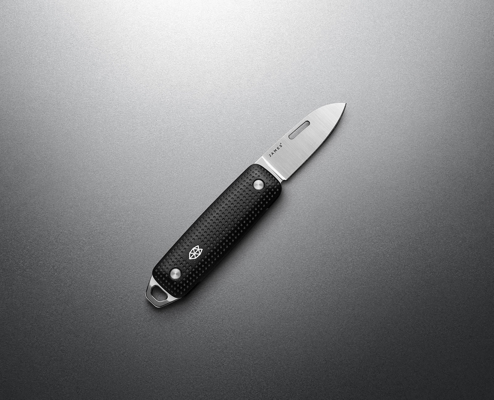 The James Brand Elko Black + Stainless EDC knife -- black handle polished stainless blade angle view keychain pocket knife