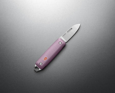 The James Brand Elko Pink Haze EDC knife -- pink machined aluminum handle stainless blade angle view keychain pocket knife