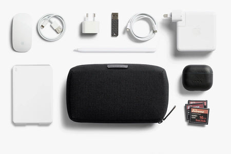 Bellroy Tech Kit in Black, closed position with layout showing contents that would fit inside