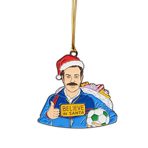 Ted “Believe in Santa” enamel ornament shown against a white background with gold hanging cord.