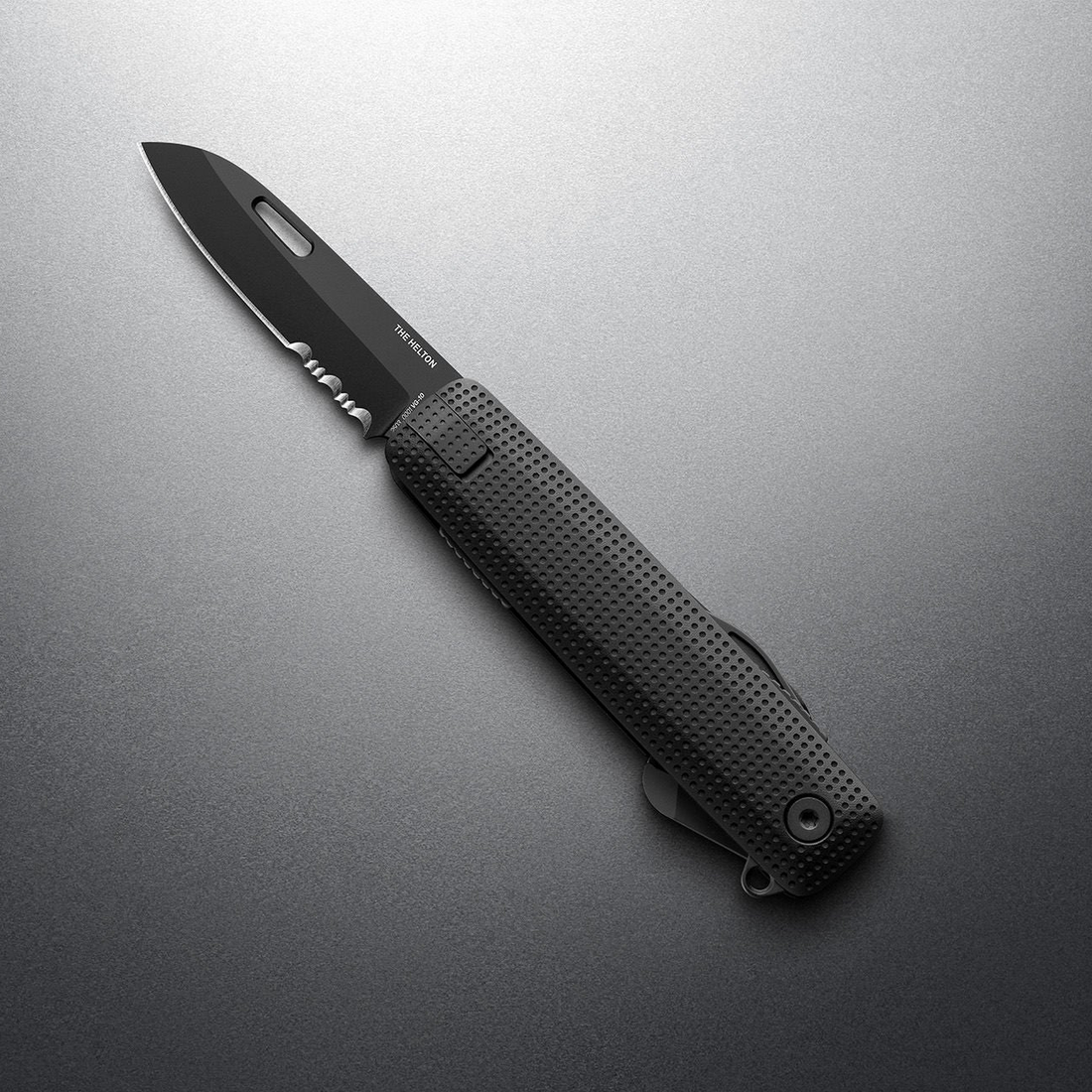 Black + Black Helton with partially serrated blade open, angled view