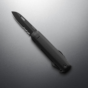 Black + Black Helton with partially serrated blade open, angled view