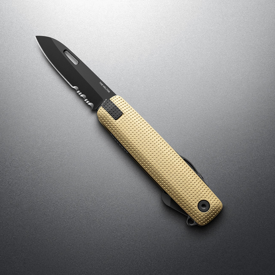 Buttermilk + Black Helton with partially serrated blade open, angled view
