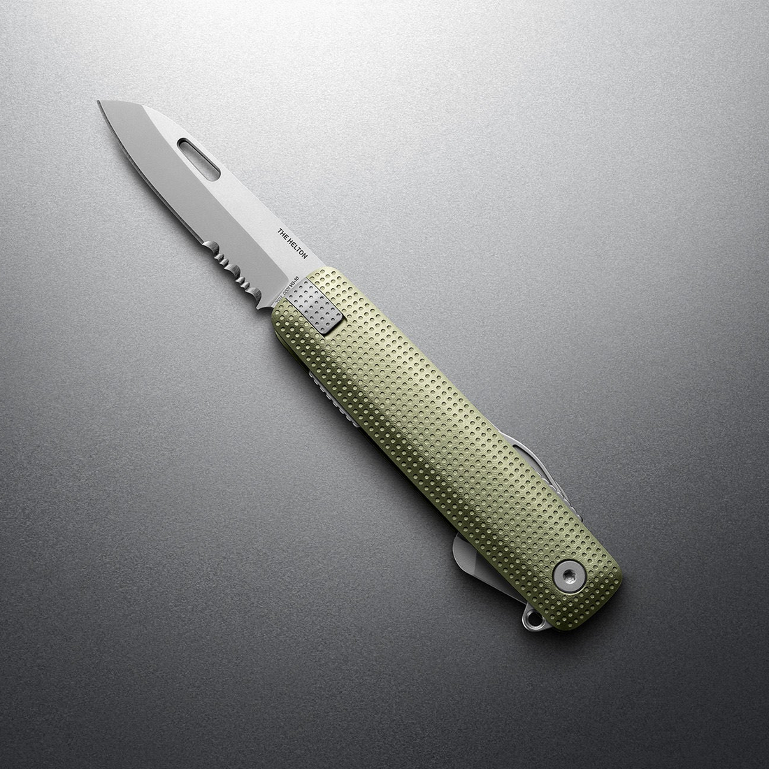 Grove + Stainless Helton with partially serrated blade open, angled view