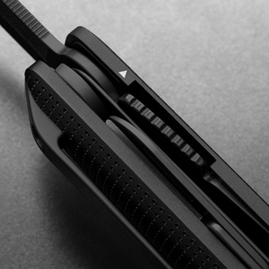 Side detail of the Helton's stacked tools and dot-textured handle in Black + Black