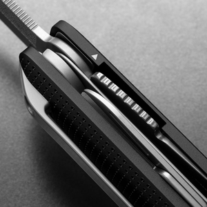 Side detail of the Helton's stacked tools and dot-textured handle in Black + Stainless