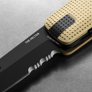 Close-up of the Helton's partially serrated blade and dot grip, Buttermilk + Black