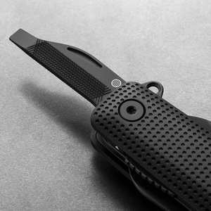 Helton in Black + Black with flathead driver and file tool extended, detail view