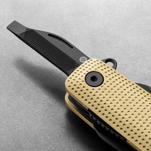 Helton in Buttermilk + Black with flathead driver and file tool extended, detail view