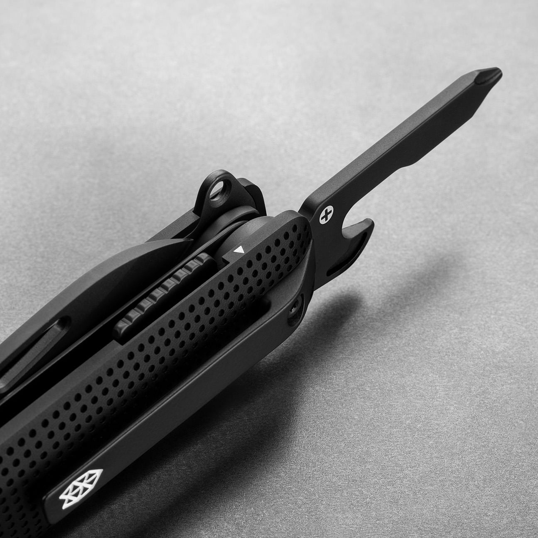 Helton in Black + Black with Phillips driver and bottle opener open, detail view