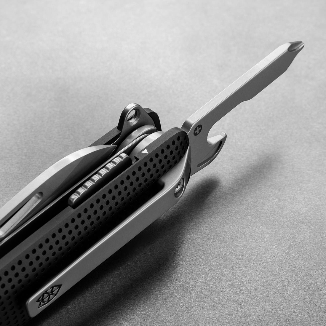 Helton in Black + Stainless with Phillips driver and bottle opener open, detail view