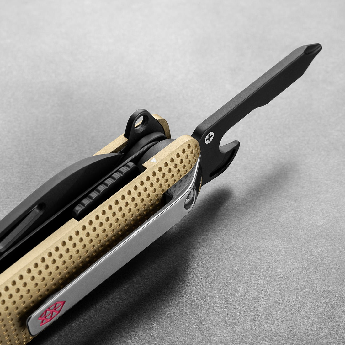 Helton in Buttermilk + Black with Phillips driver and bottle opener open, detail view