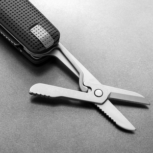 Spring-action scissors open on the Helton in Black + Stainless, close-up