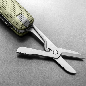 Spring-action scissors open on the Helton in Grove + Stainless, close-up