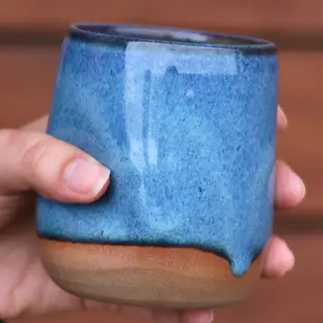 Jordan-Jean Ceramics thumb cup floating blue showing thumb indent grip detail