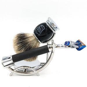 Chrome razor and shaving brush stand holding black brush and cartridge razor, grooming accessory at The Simple Man Omaha