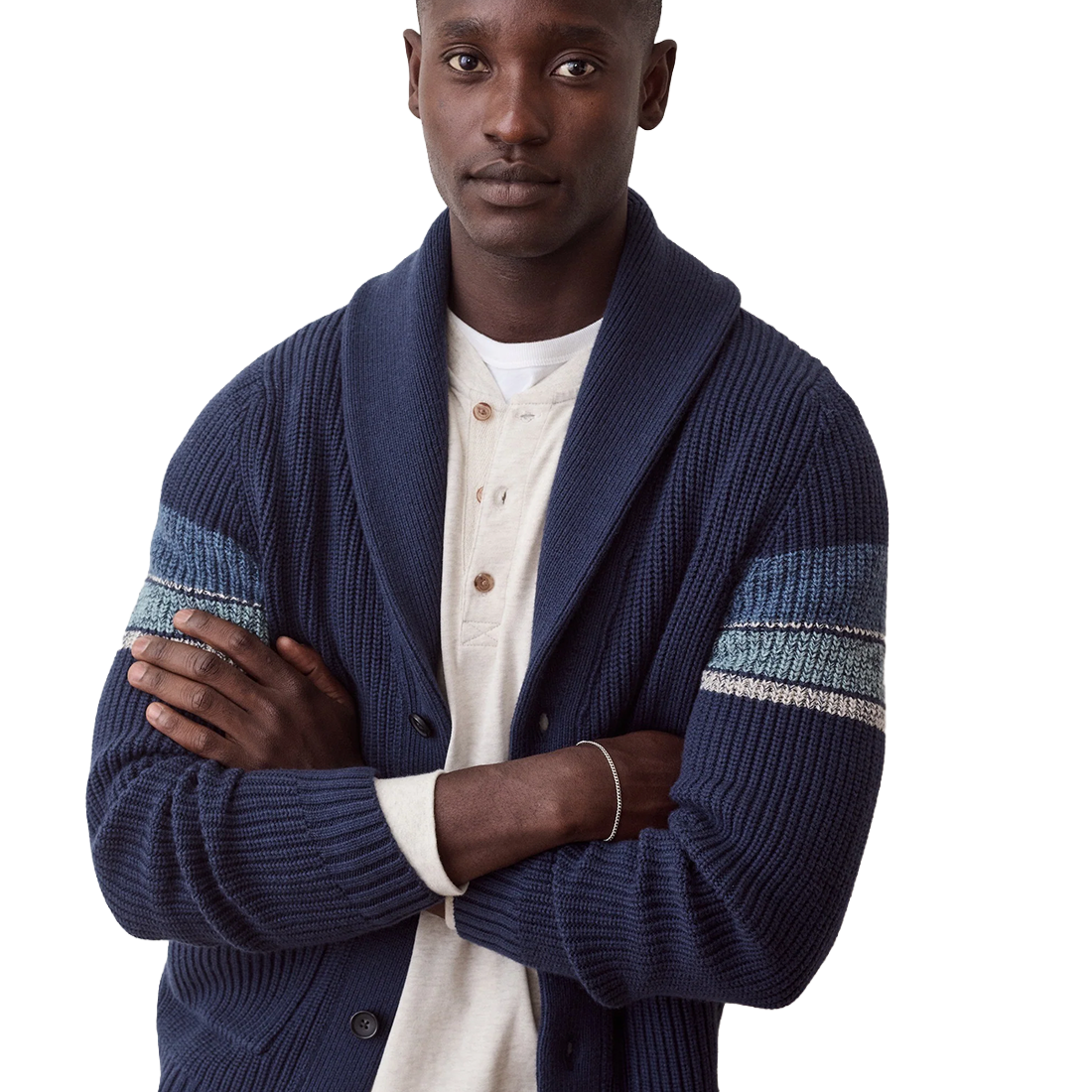 Man with arms crossed in the navy Varsity Shawl Cardigan over a cream henley, showing the striped sleeves