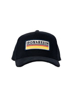 Front of black vintage corduroy hat with Iron & Resin embroidered patch logo