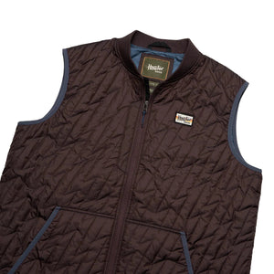 Laid flat Voltage Quilted Vest showing ripstop texture, snap chest pocket, and ribbed collar
