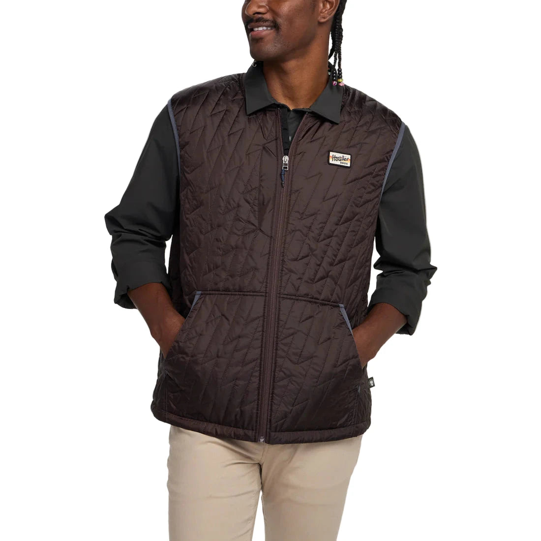 Front view of man wearing lightweight Voltage Quilted Vest in Bark with kangaroo pockets