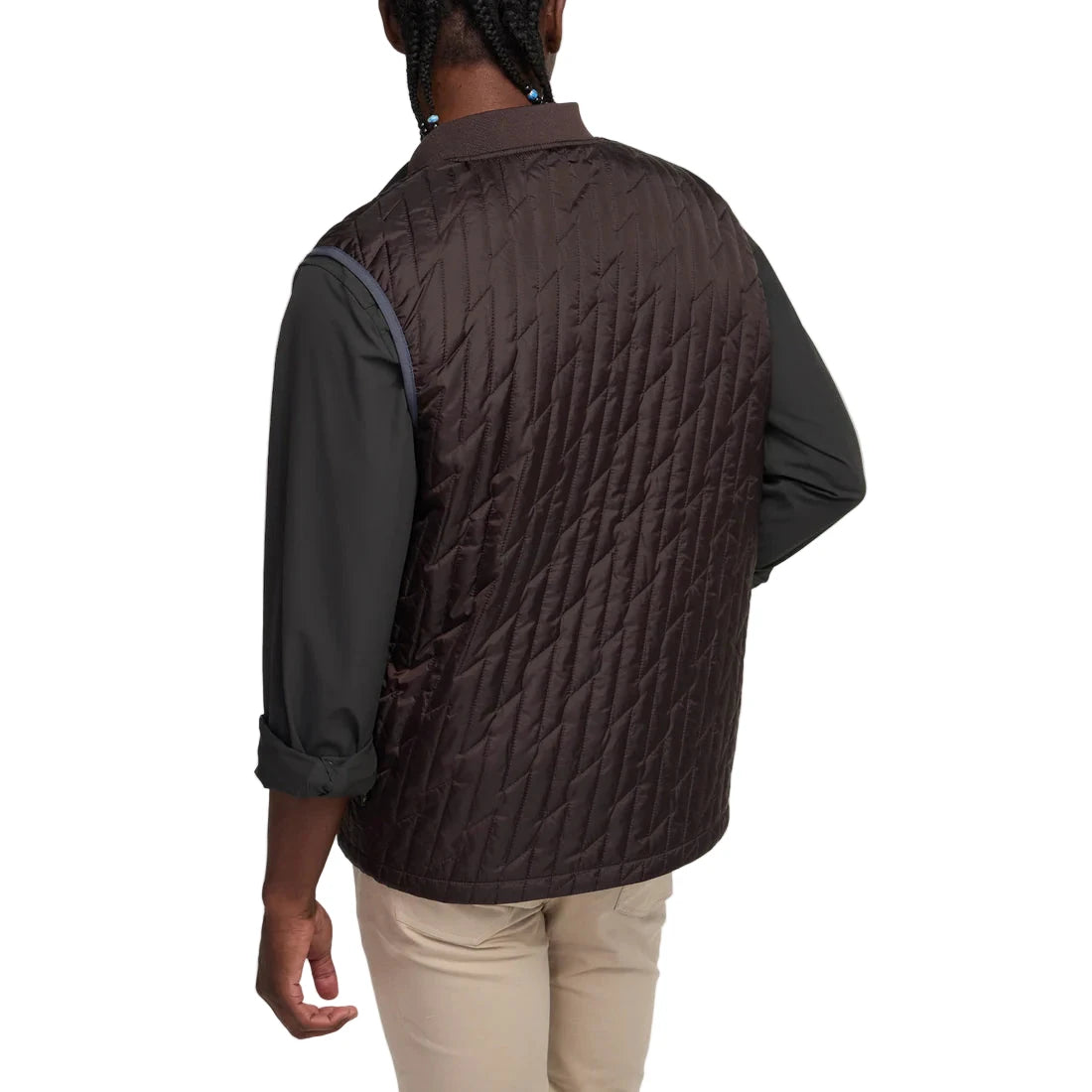 Back view of man wearing Voltage Quilted Vest in Bark with lightning bolt quilting