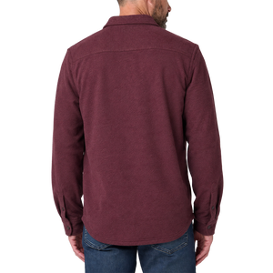 Back view on model of the Windsor Wine knit shirt showing the shoulder yoke, shirttail hem and button tab cuffs