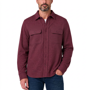 Man in the Windsor Wine knit button-up with two flap chest pockets, worn over a white tee with dark jeans