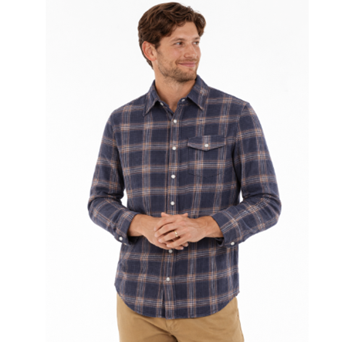 Man wearing Waffle Plaid Pearl Snap Shirt in Navy, smiling, styled with khaki pants - The Simple Man