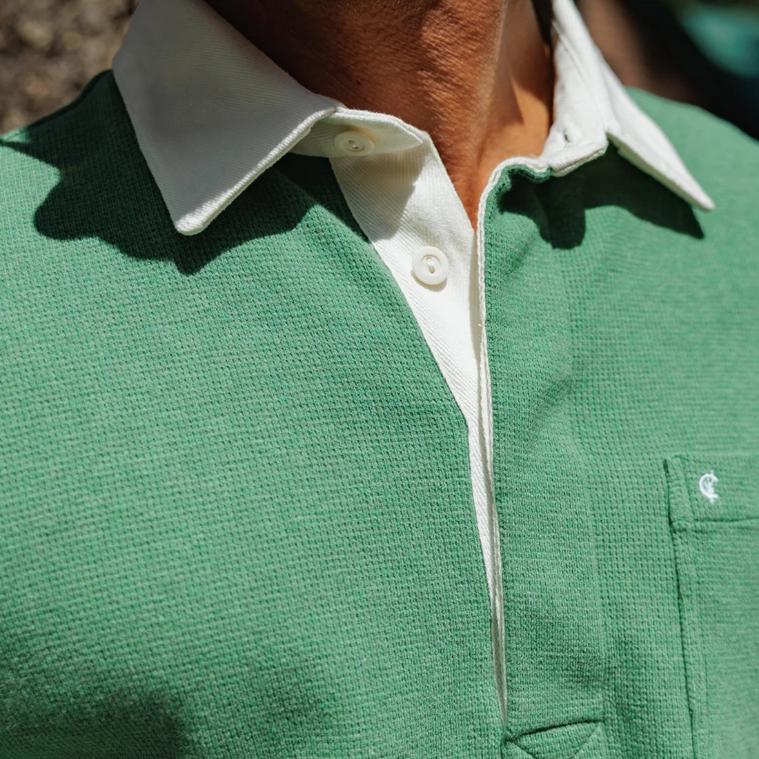 Close-up of Waffle Rugby Shirt in Heather Green collar and placket detail in sunlight - The Simple Man
