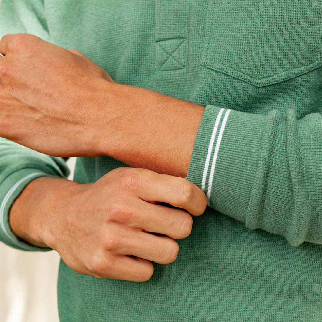 Close-up of Waffle Rugby Shirt in Heather Green cuff detail with striped ribbing - The Simple Man
