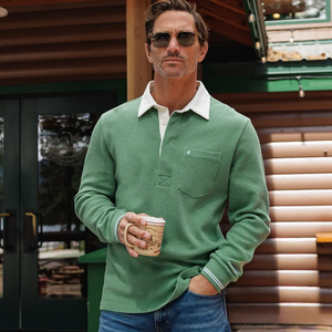 Man wearing Waffle Rugby Shirt in Heather Green holding coffee mug outside a cabin - The Simple Man