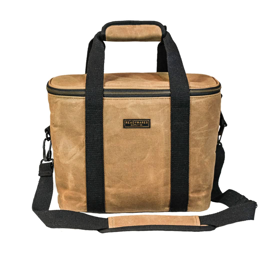 Tan waxed canvas 18L cooler bag with black webbing handles, shoulder strap and brand patch, front view, The Simple Man