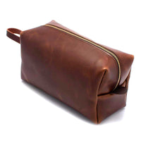 Brown leather dopp kit with brass zipper and side handle – men’s toiletry bag from The Simple Man