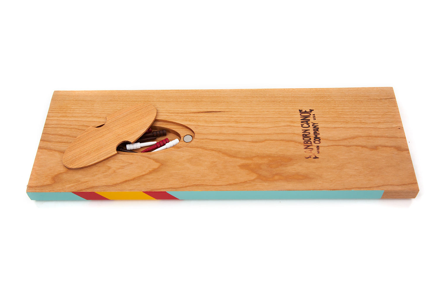 Back of the West Cribbage Board showing Cherry wood finish, magnetic storage compartment, and included cribbage pegs.