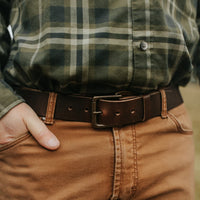 Man wearing Range Leather Co. Windom Belt in nut brown with flannel shirt and chinos – full grain leather men's belt