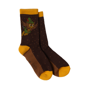 Pair of basalt brown crew socks with Woodsy Owl in a green cap and mustard cuff, heel and toe