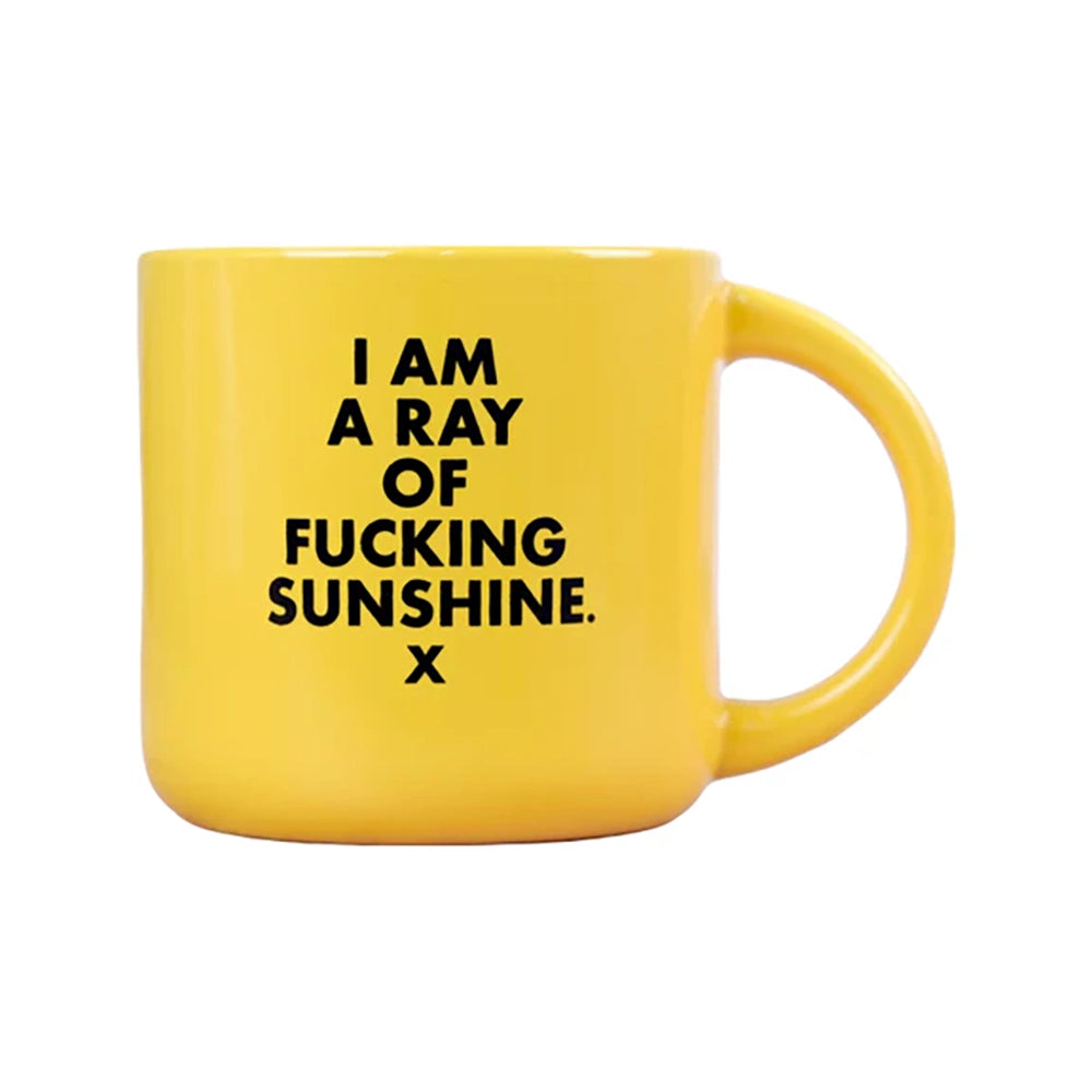 Yellow coffee mug with "I'm a ray of Fucking Sunshine" in black screen print.