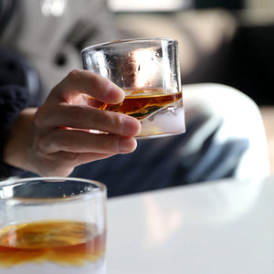 Man holding Yosemite Crystal Whiskey Glass filled with whiskey, lifestyle shot - The Simple Man