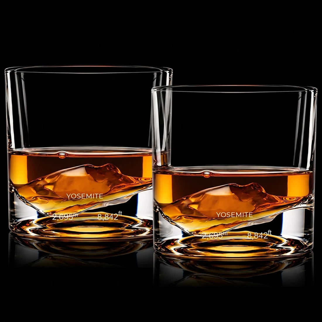 Two Yosemite Crystal Whiskey Glasses with whiskey showing sculpted mountain base and Yosemite elevation engraving - The Simple Man