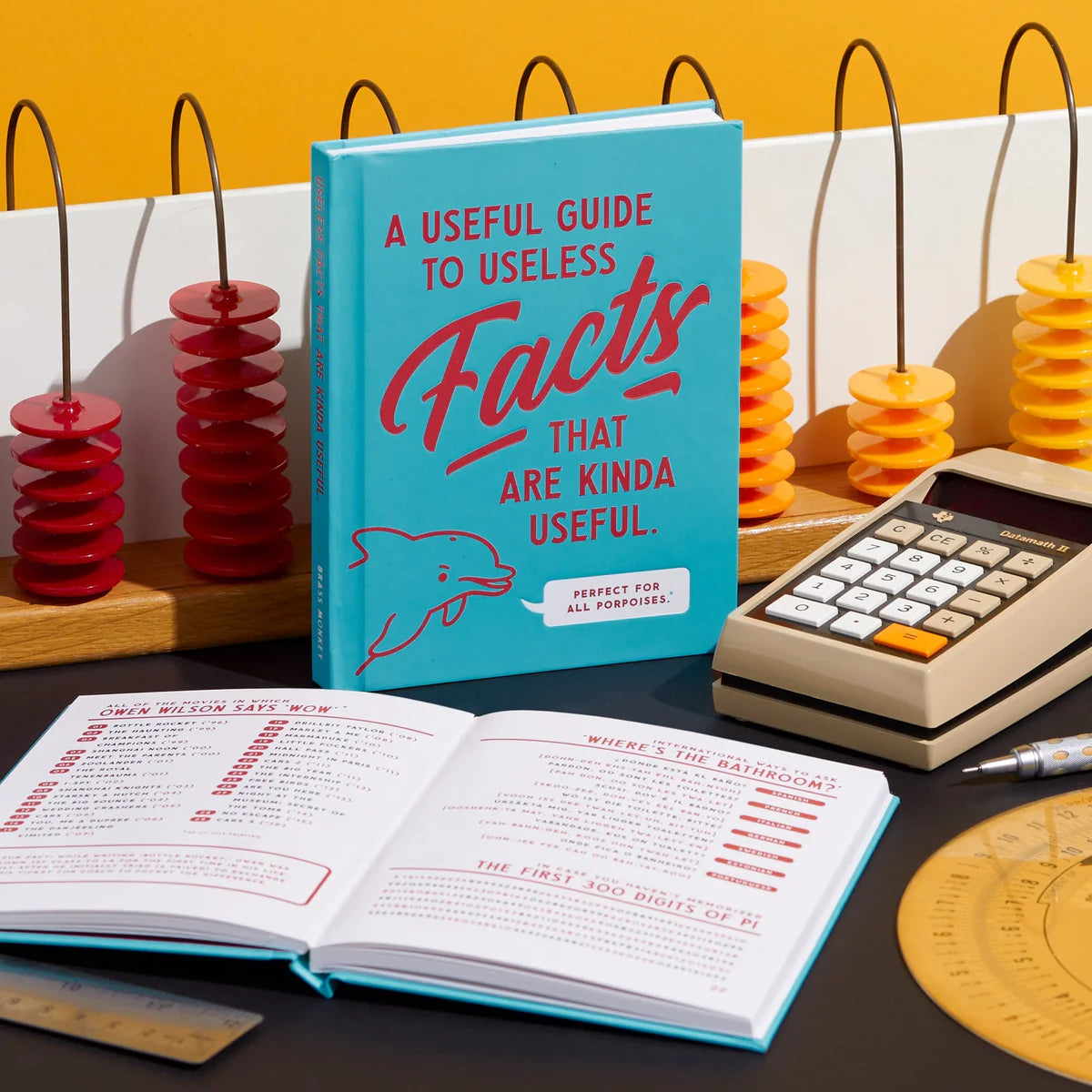 A Useful Guide to Useless Facts by Brass Monkey open book showing interior charts and lists