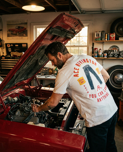 Back of Ace Rivington Denim and Co chalk t-shirt with vintage graphic worn by man working on classic car engine – The Simple Man