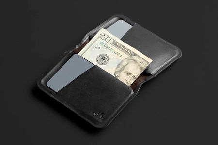 Bellroy apex slim sleeve wallet in black open with cash detail view
