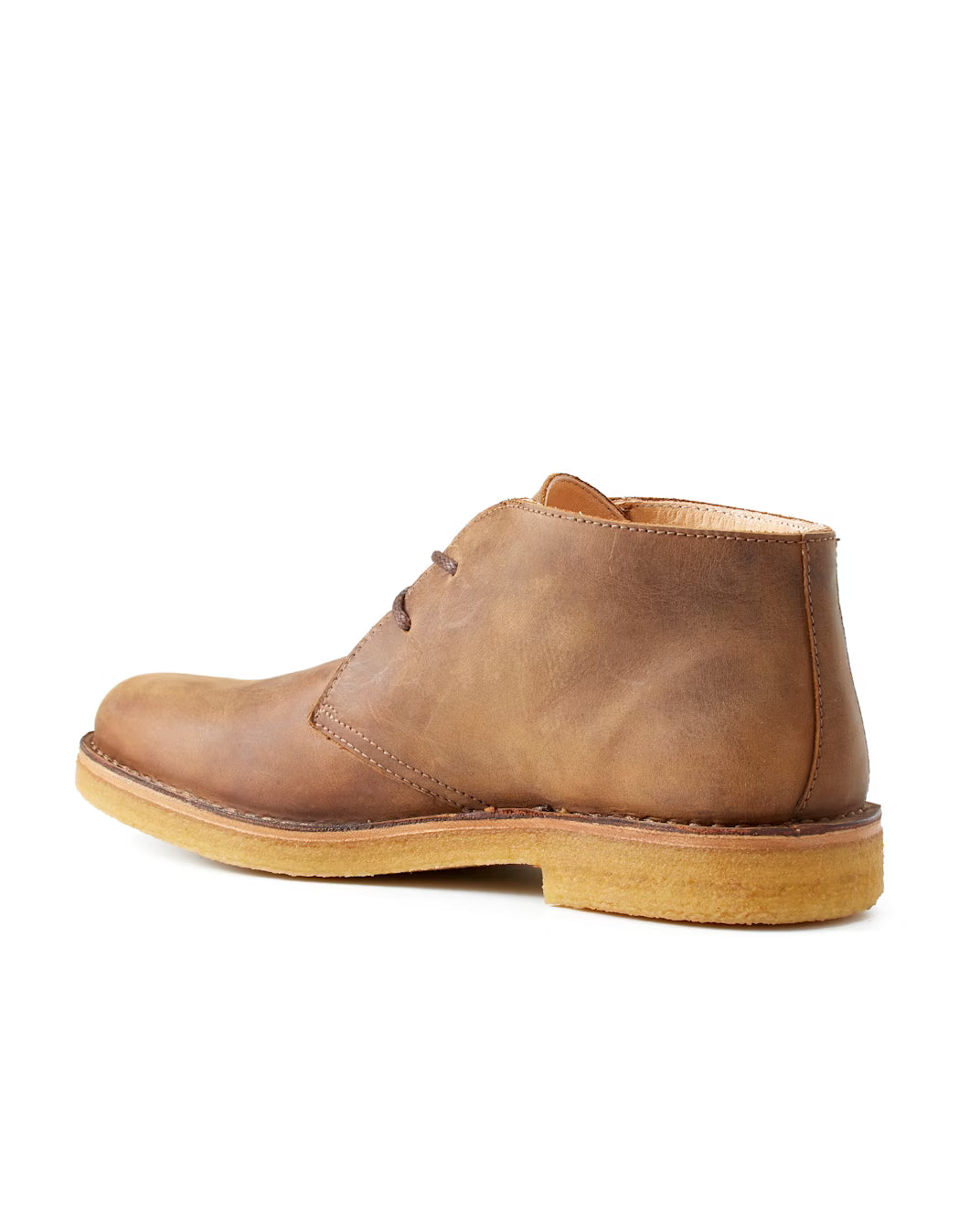 Close-up of handcrafted Astorflex Greenflex chukka boot in waxed nubuck leather showing detail of stitching and suede texture