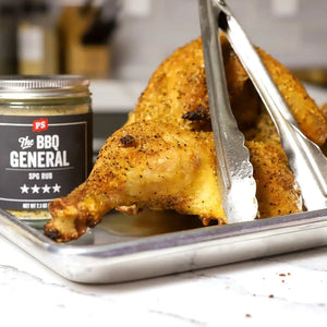 PS Seasoning BBQ General SPG rub jar next to golden roasted chicken on sheet pan – salt pepper garlic BBQ seasoning 7.1oz