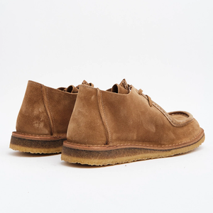 Heels of the whiskey suede Beenflex showing the leather welt and crepe sole, back view, The Simple Man